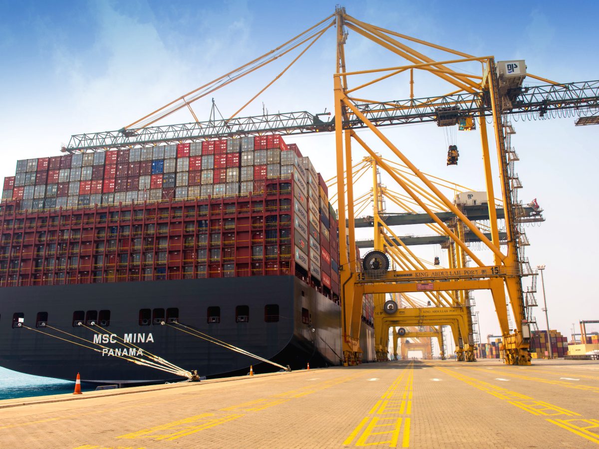 Ship being loaded with cargo at Port Salah, Oman, nearby block paving sealed with Resiblock